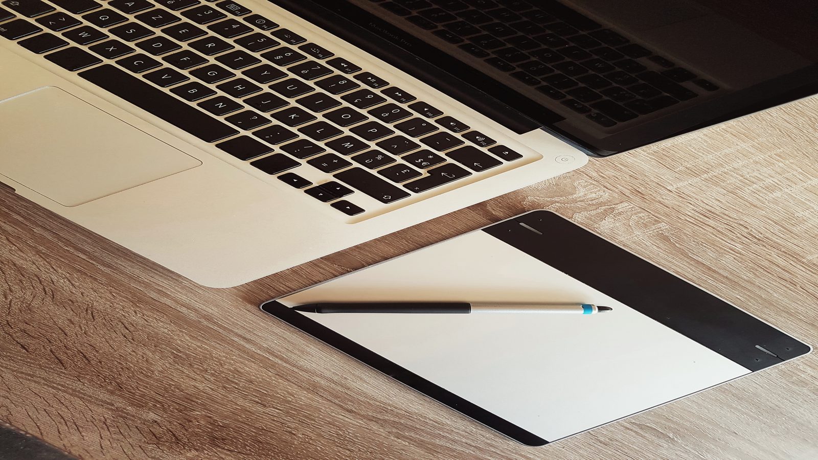 Editorial desk with match notes and a browser window showing a football game